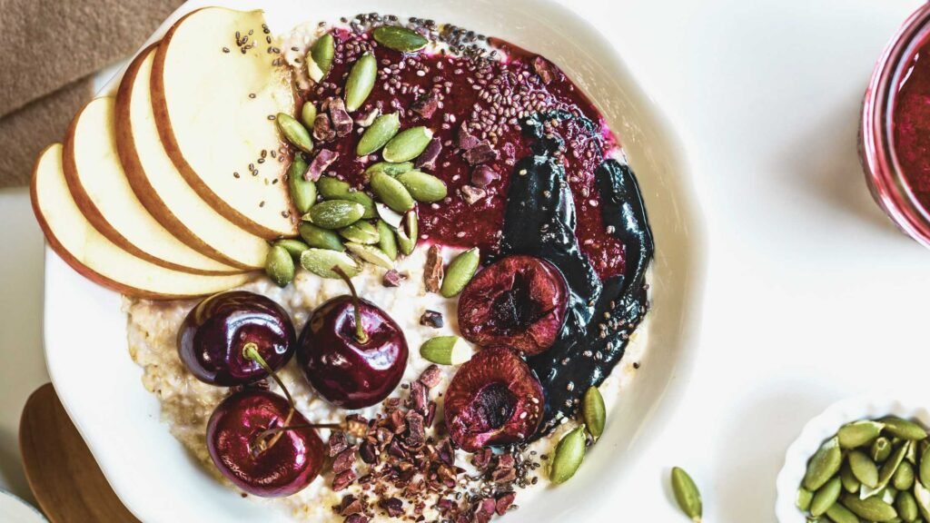 Oatmeal topped with cacao nibs and berries